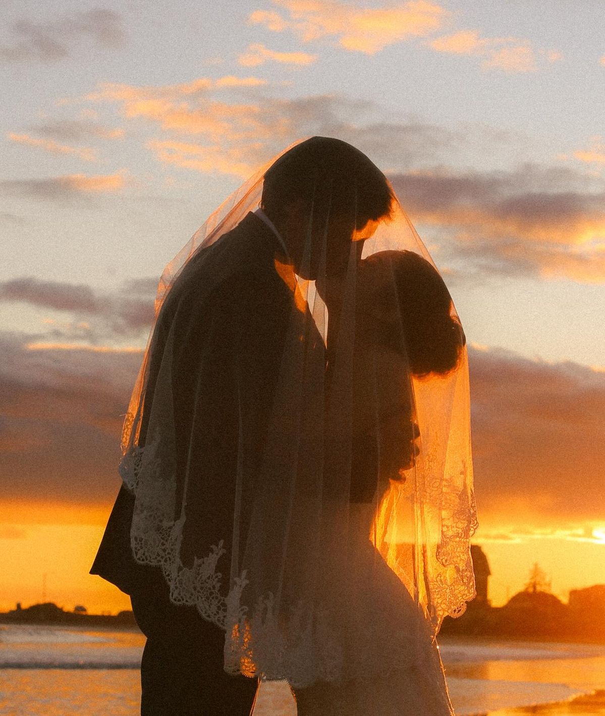Kissing-Silhouette-against-Sunset-Sky