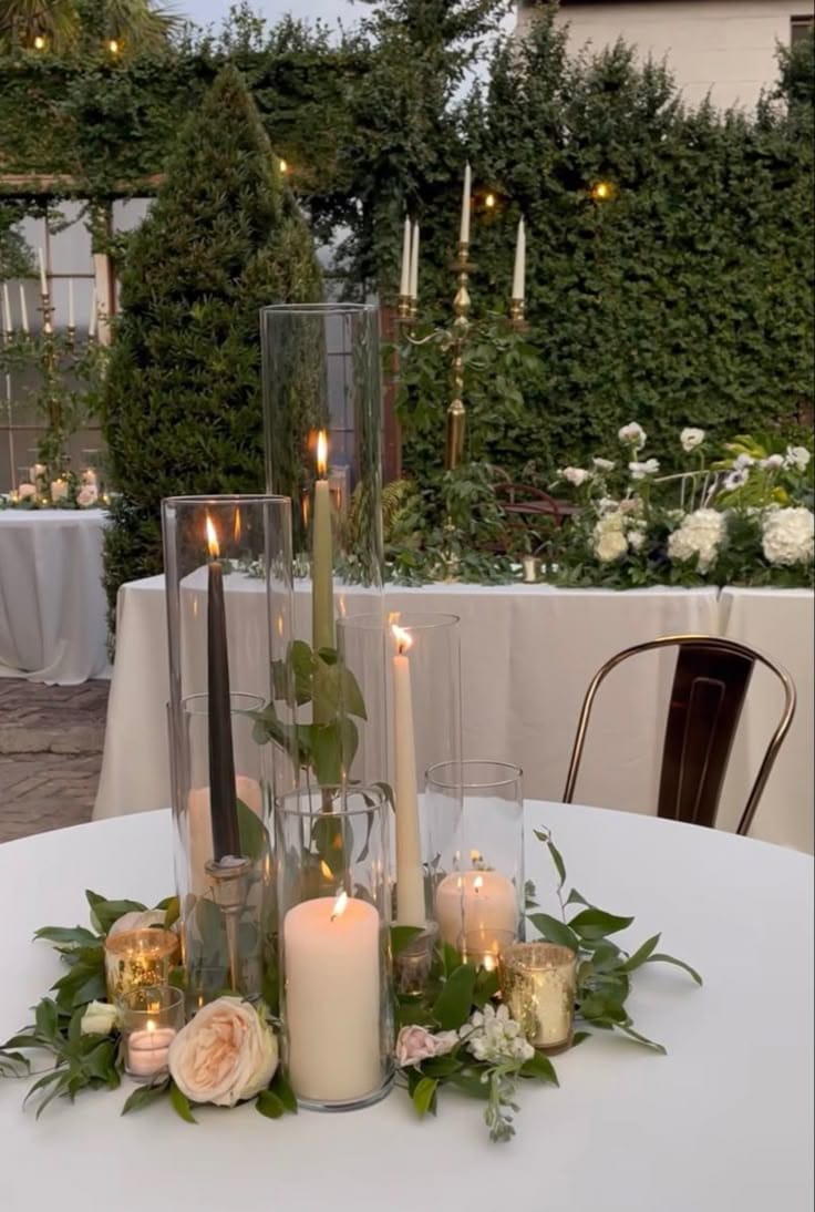Tall Candle Centerpieces in Hurricane Vases