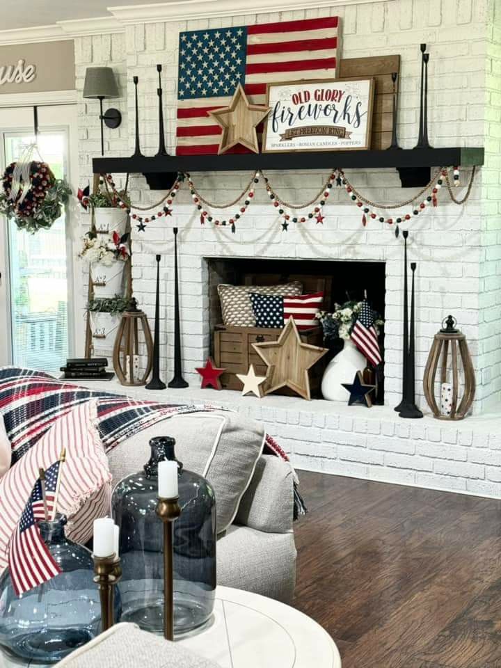 A-patriotic-photo-wall-above-a-simple-mantel-setup.